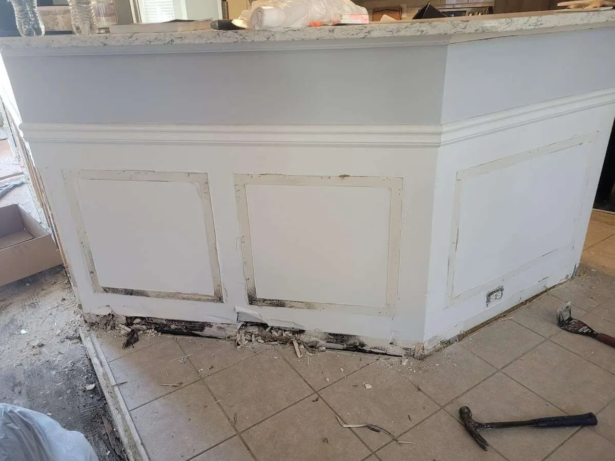Water damage and mold on kitchen during Sewage Cleanup & Sanitation in Cedarhurst